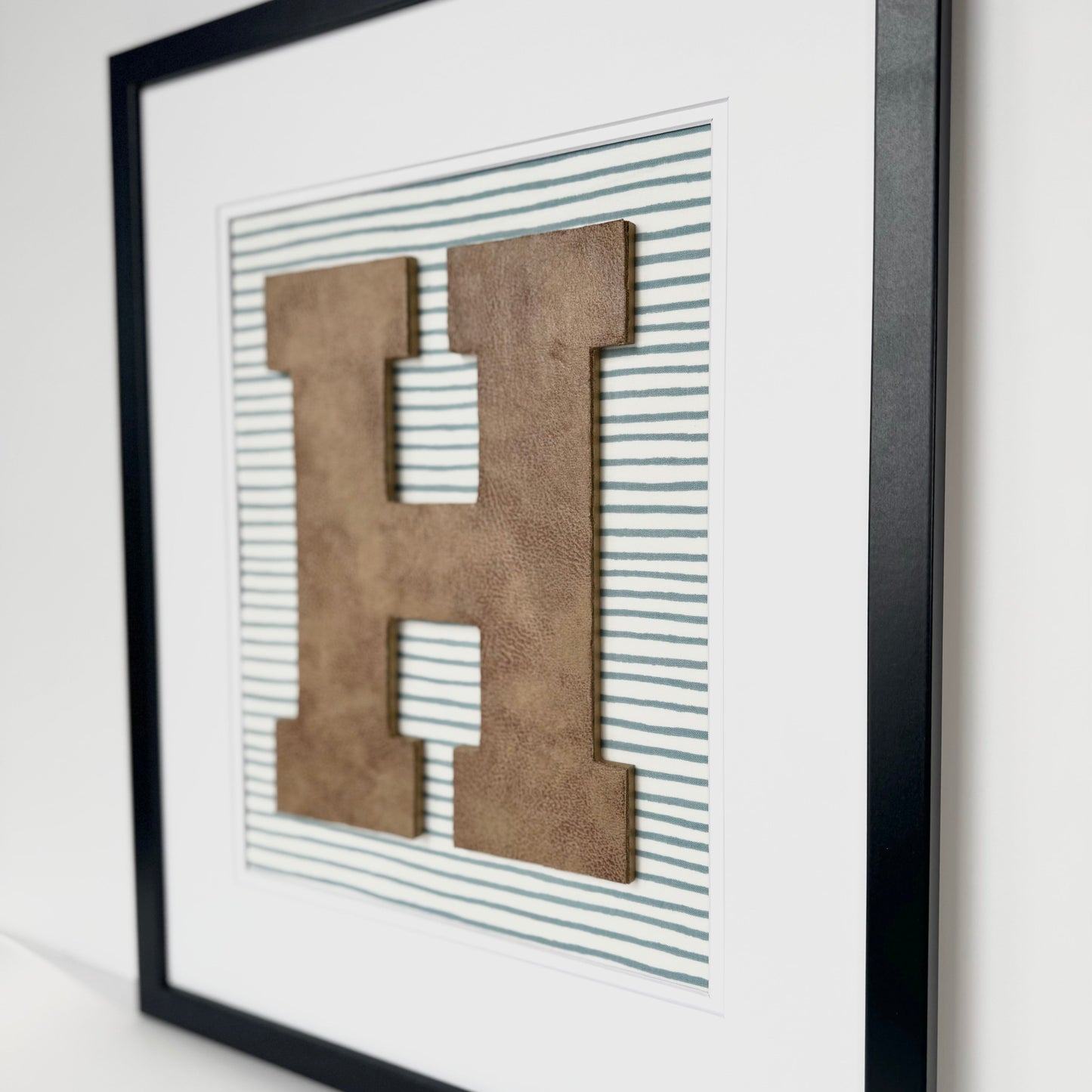 Framed Leather Initial on Light Blue Wavy Stripe, 18x22" Frame
