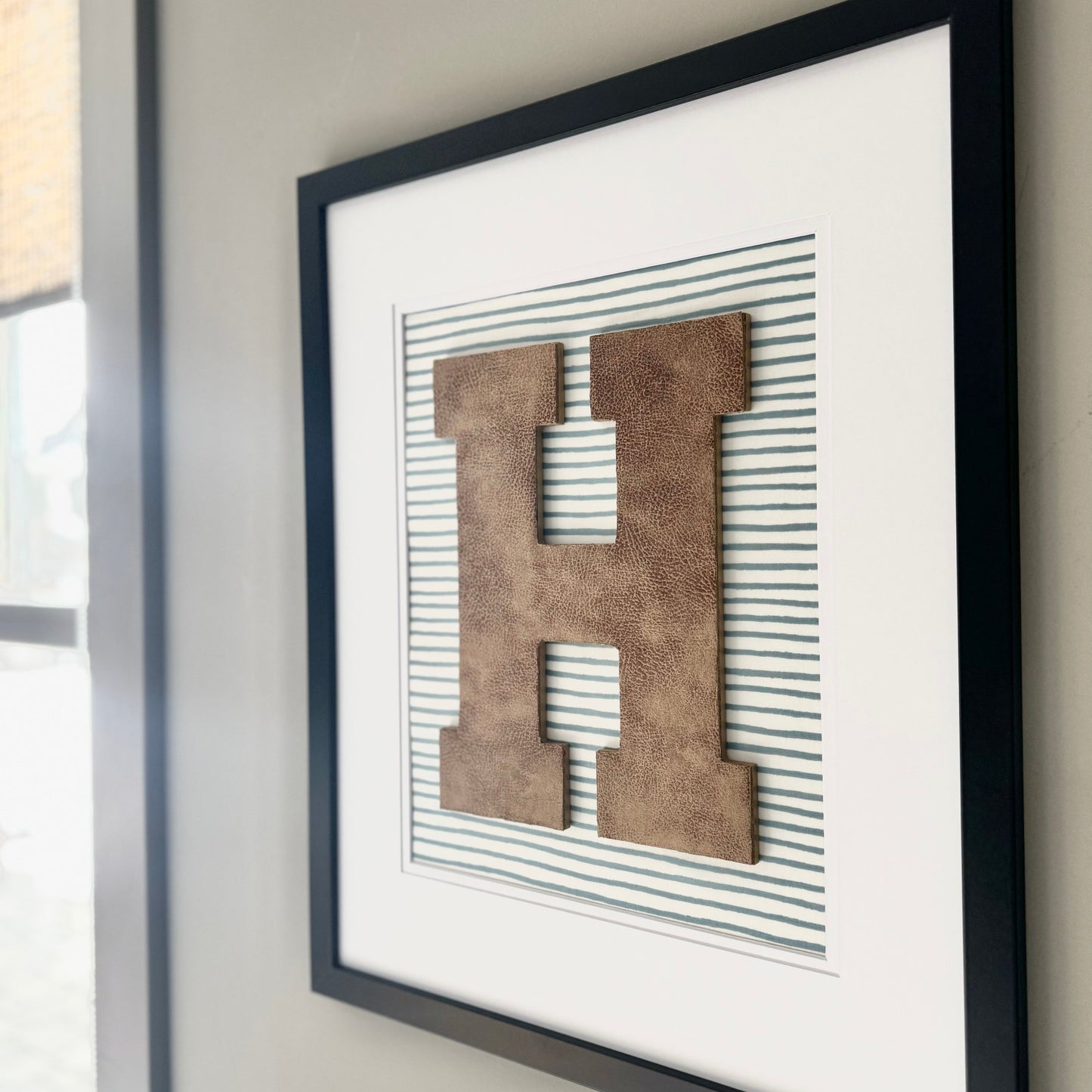 Framed Leather Initial on Light Blue Wavy Stripe, 18x22" Frame