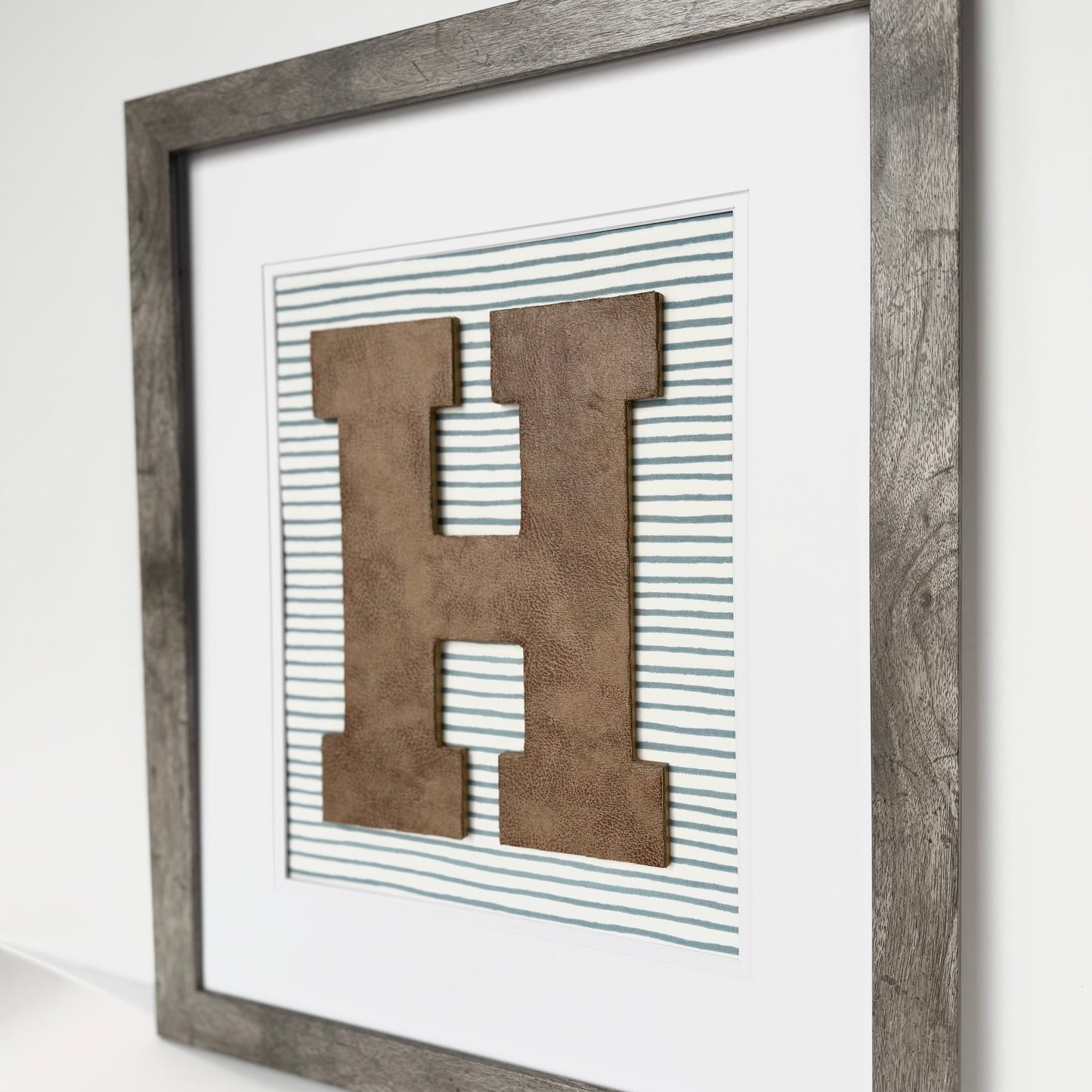 Framed Leather Initial on Light Blue Wavy Stripe, 18x22" Frame