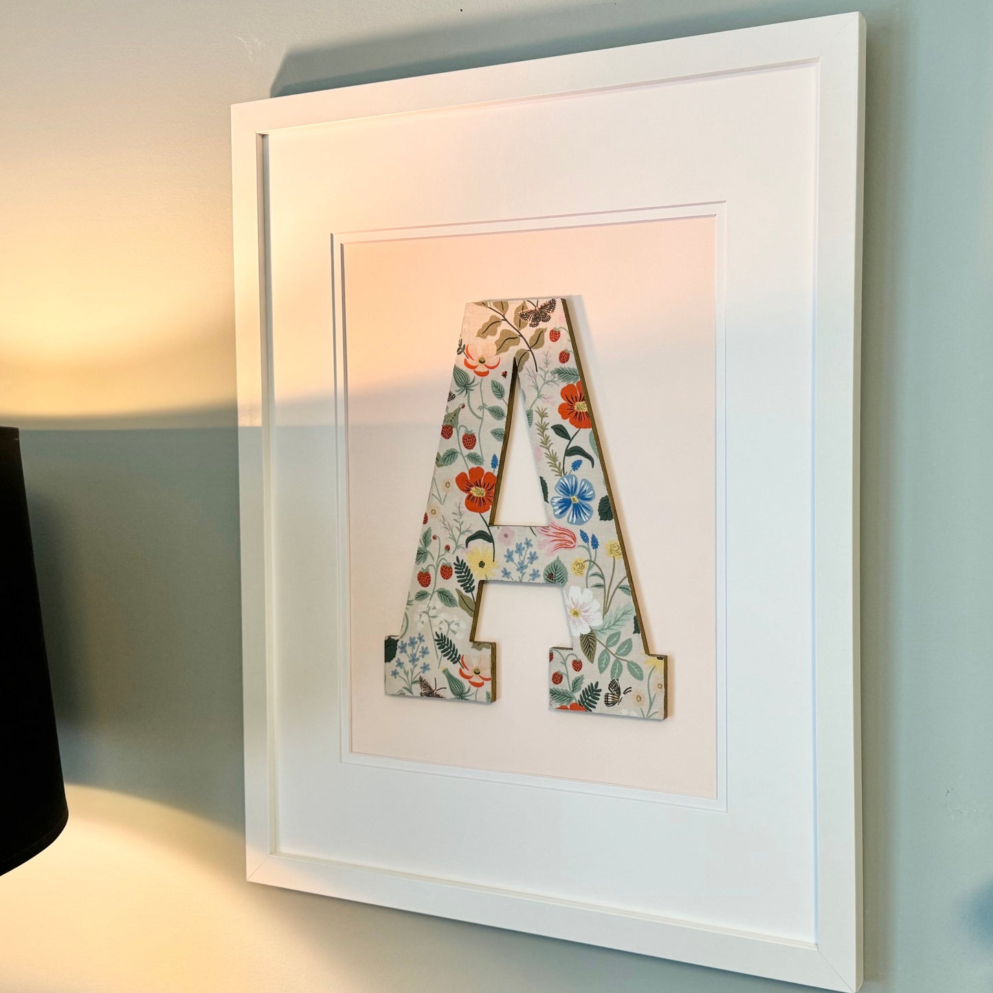 White Framed Strawberry and Flowers print nursery letter A on a pale pink background