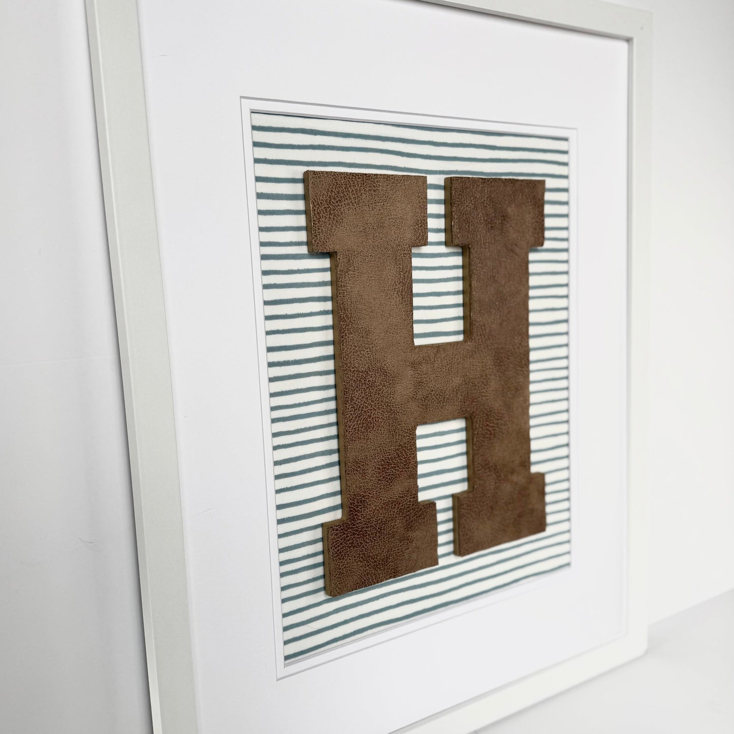 Framed Leather Initial on Light Blue Wavy Stripe, 18x22" Frame