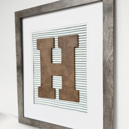 Framed Leather Initial on Light Blue Wavy Stripe, 18x22" Frame