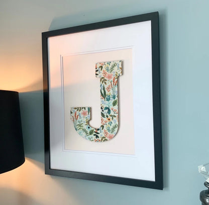 Black Framed Herb Garden floral print Nursery Letter on a pale pink background