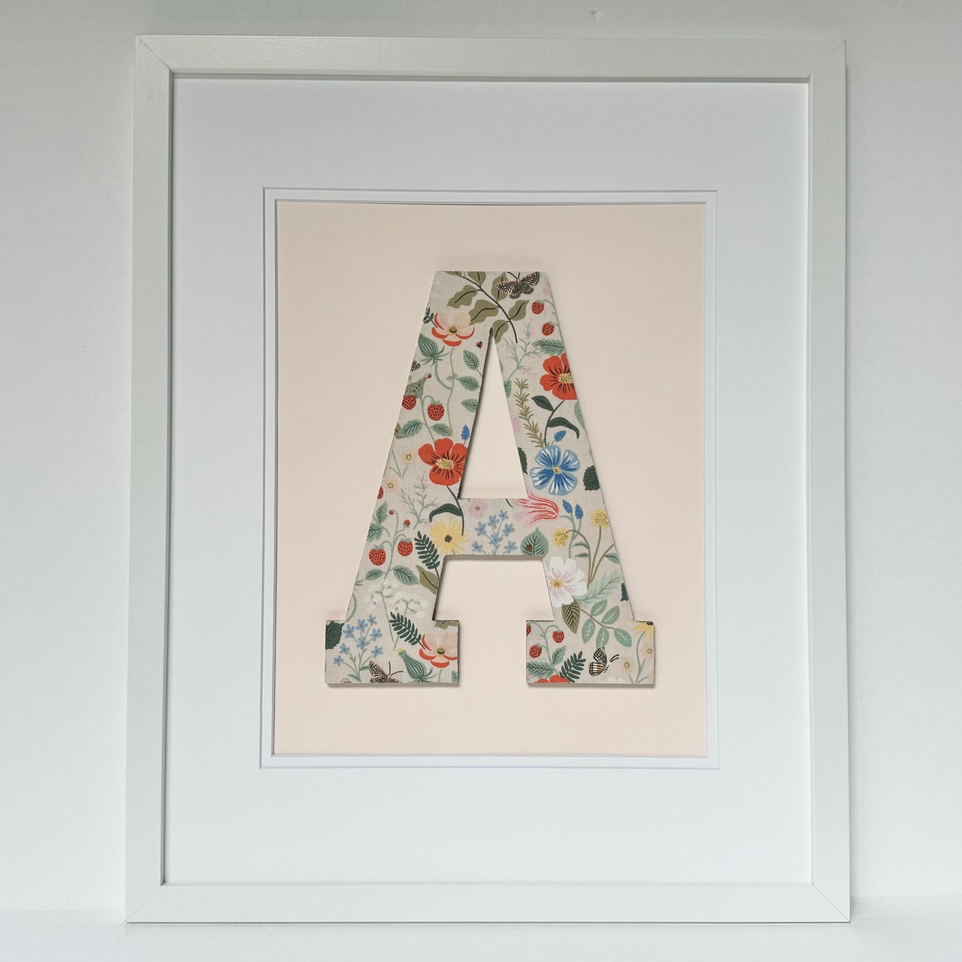 White Framed Strawberry and Flowers print nursery letter A on a pale pink background